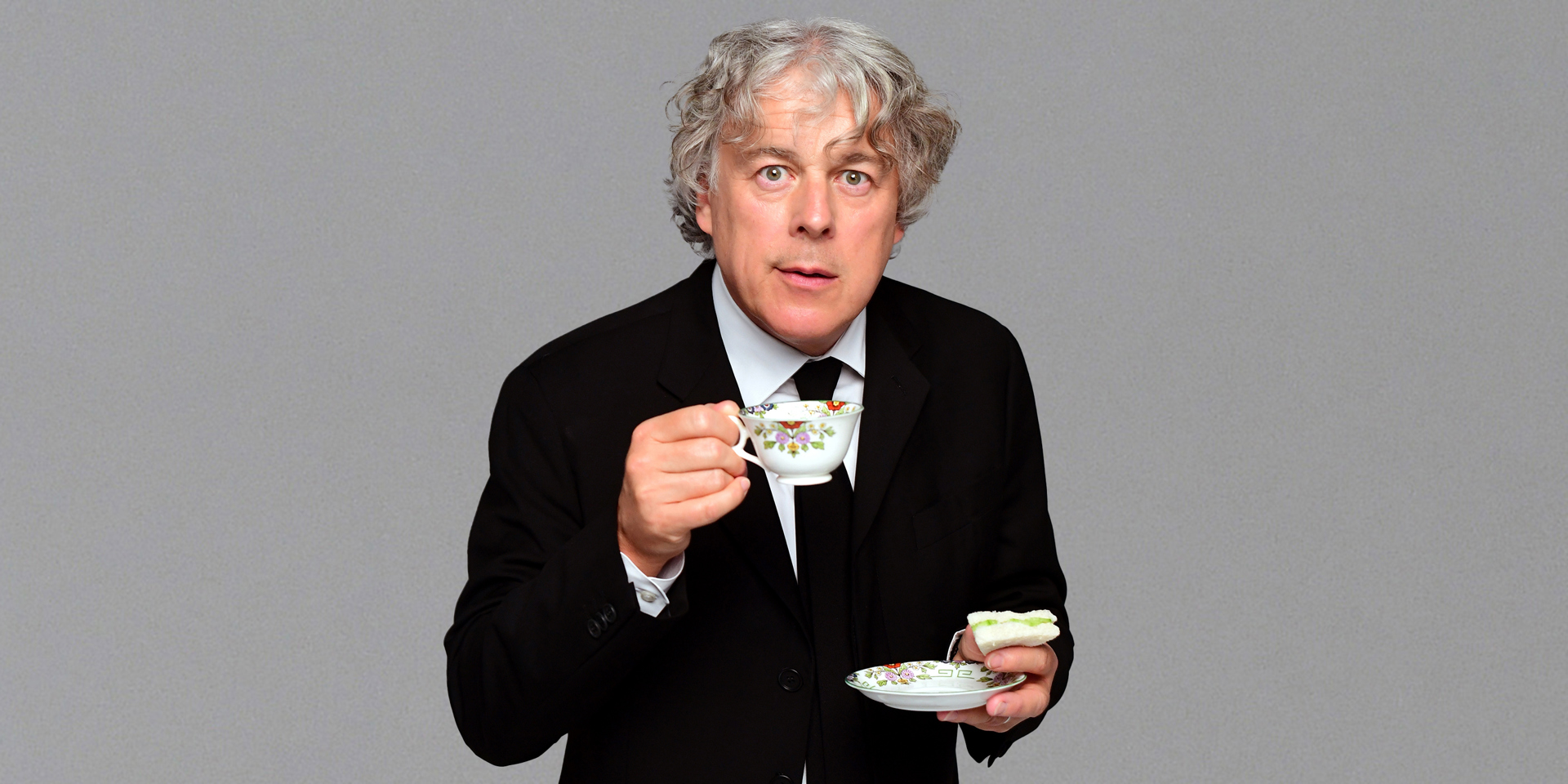 A portrait of contributor Alan Davies.