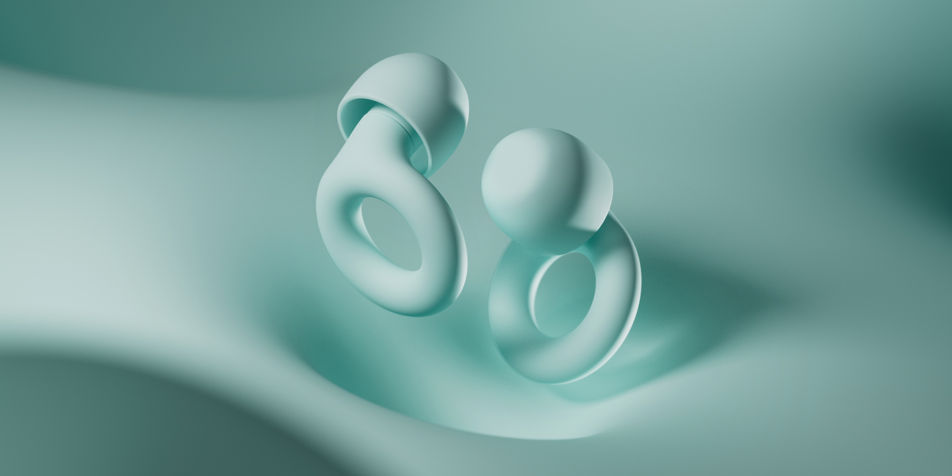 Loop earplugs on a silky, mint coloured background.