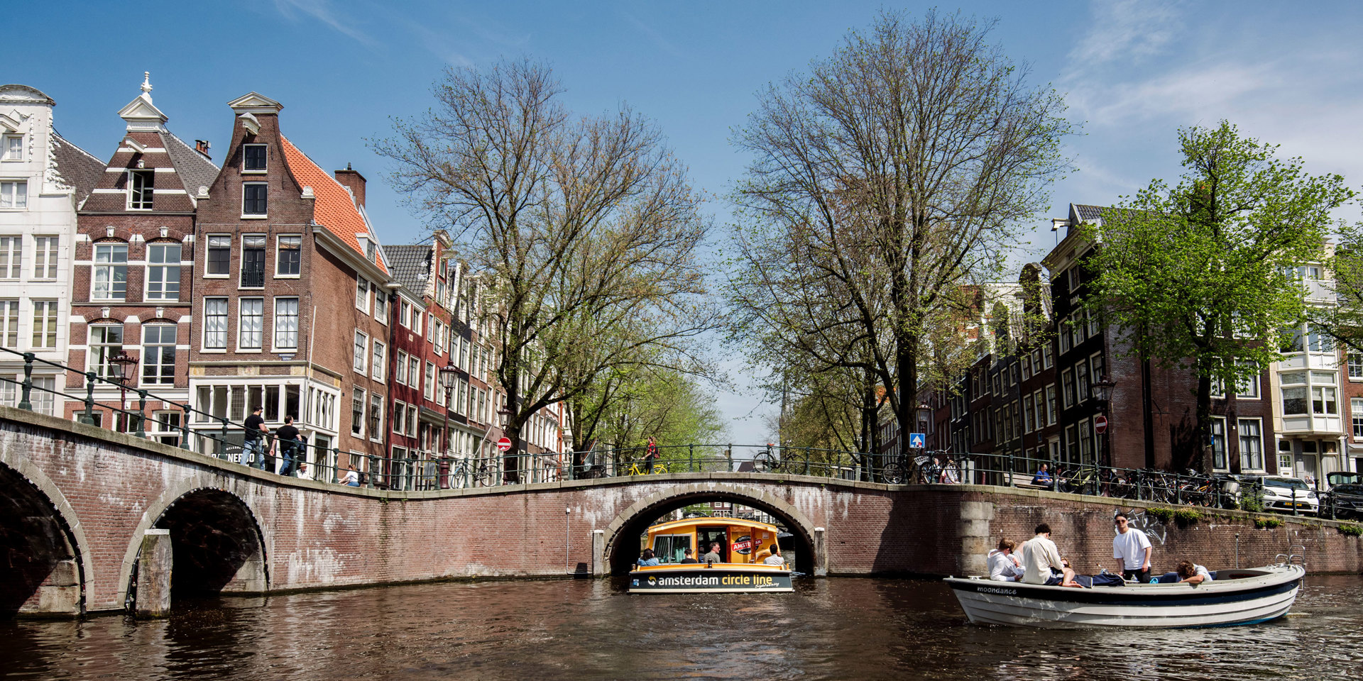 The view from a boat of an Amsterdam canal.