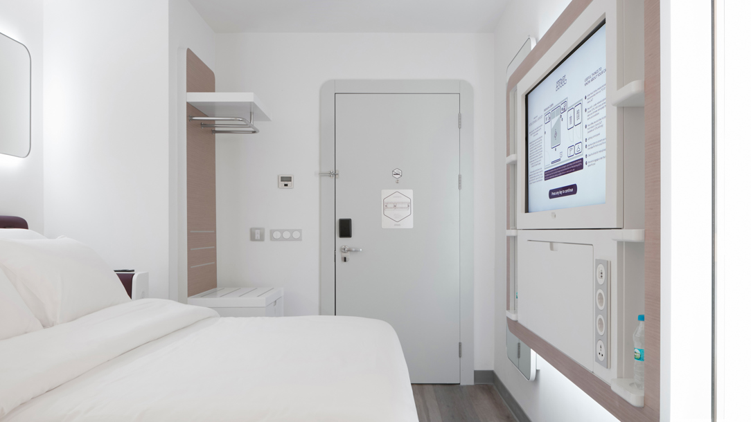 A white hotel room at YOTEL Istanbul airport.