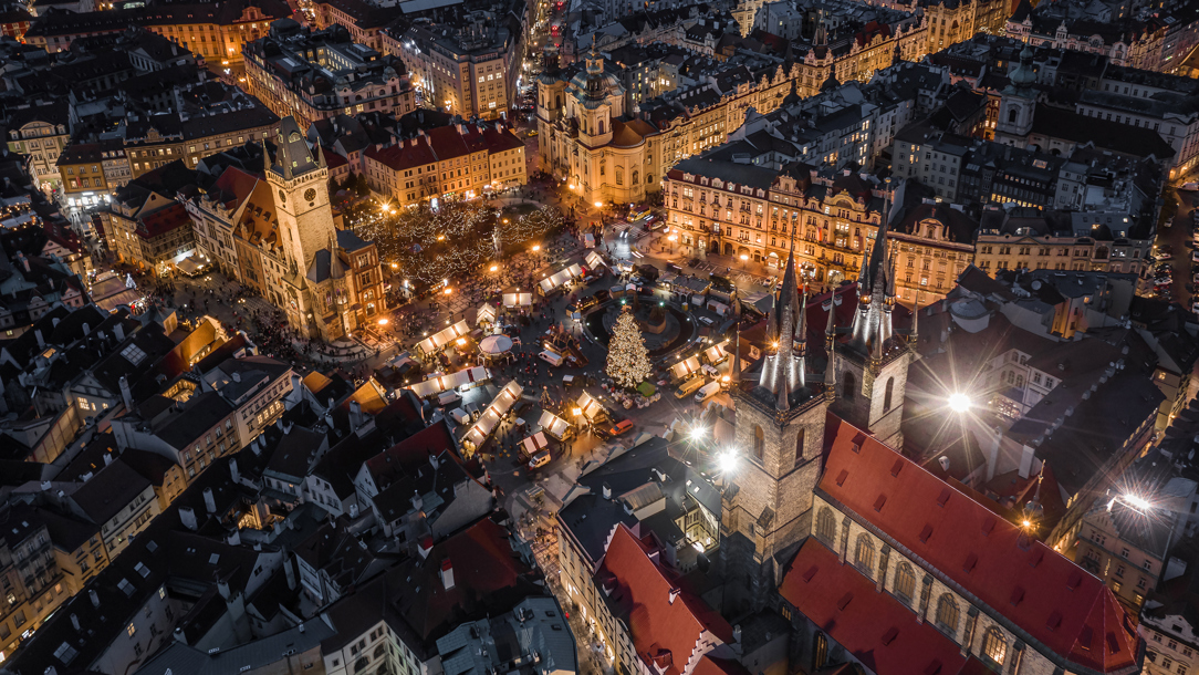 An aerial view of the Christmas market in Prague at night.