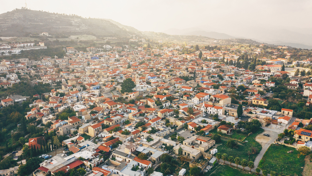 An overhead view of a village in Larnaca at sunset.