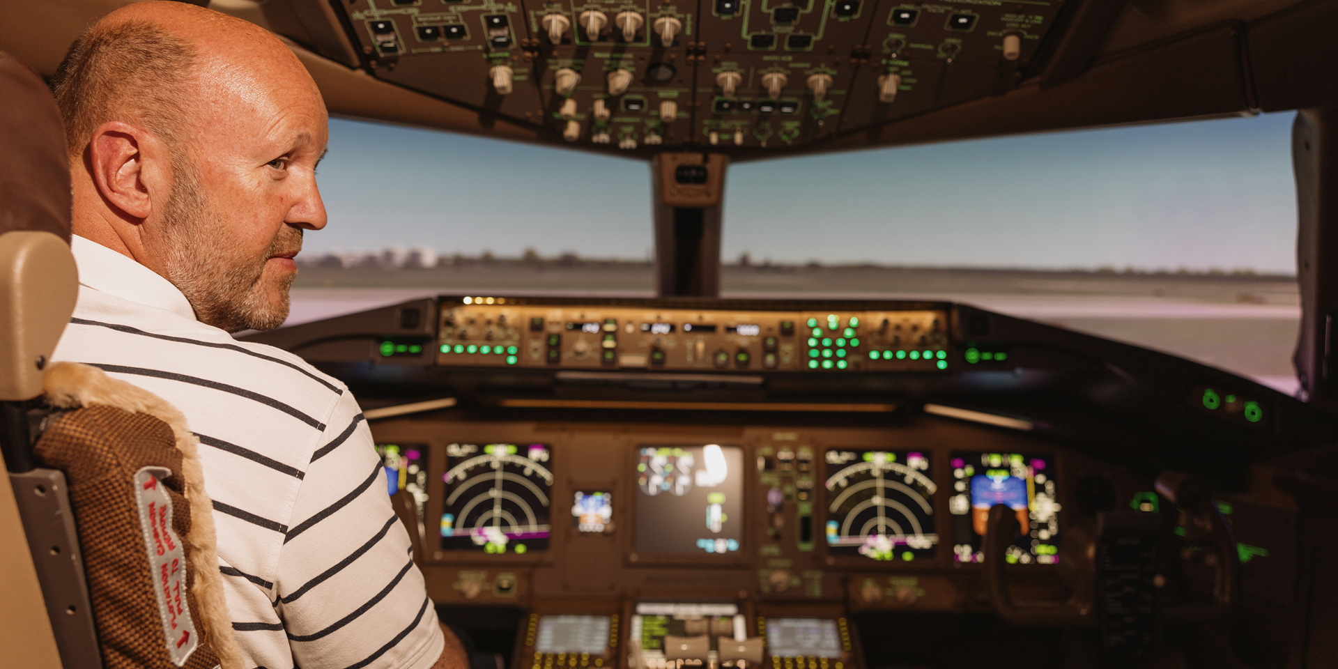 Gary McCombie seated in his 777 simulator.