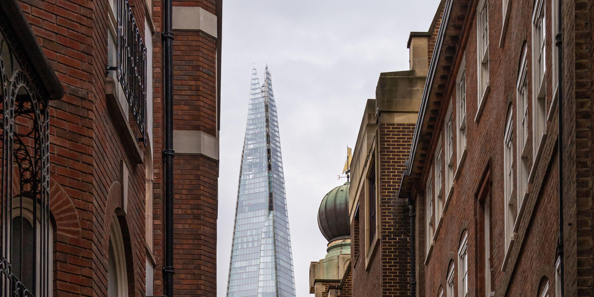 A view of the Shard between Victorian terraced houses.
