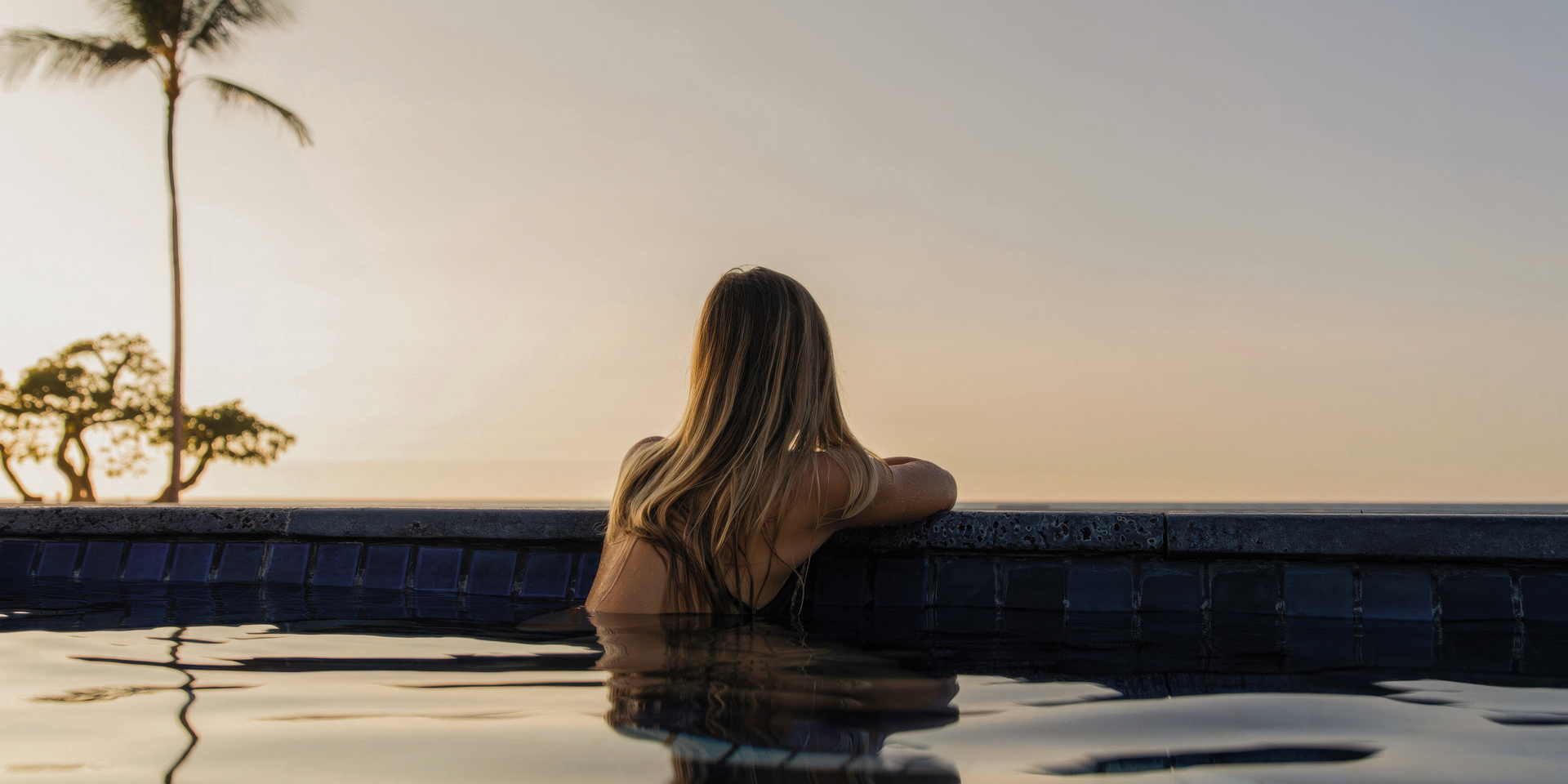 A woman in an infinity pool