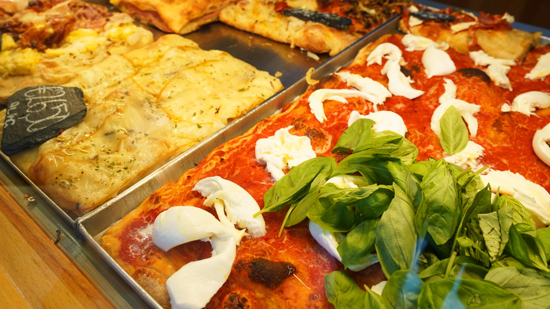 Food on display at Bonci Pizzarium.
