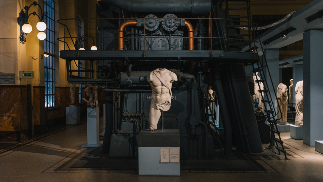 Antique statues on display in a museum.