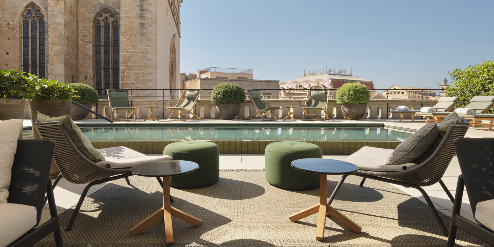 Chairs and the swimming pool on the roof of Hotel Sant Francesc Palma De Mallorca.