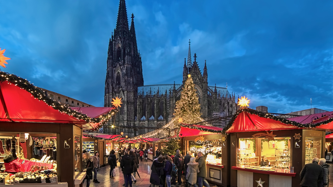 A Christmas market outside a church.