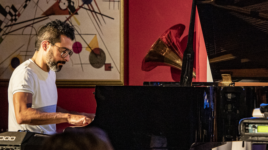 Musician Tarek Yamani  at his keyboard.