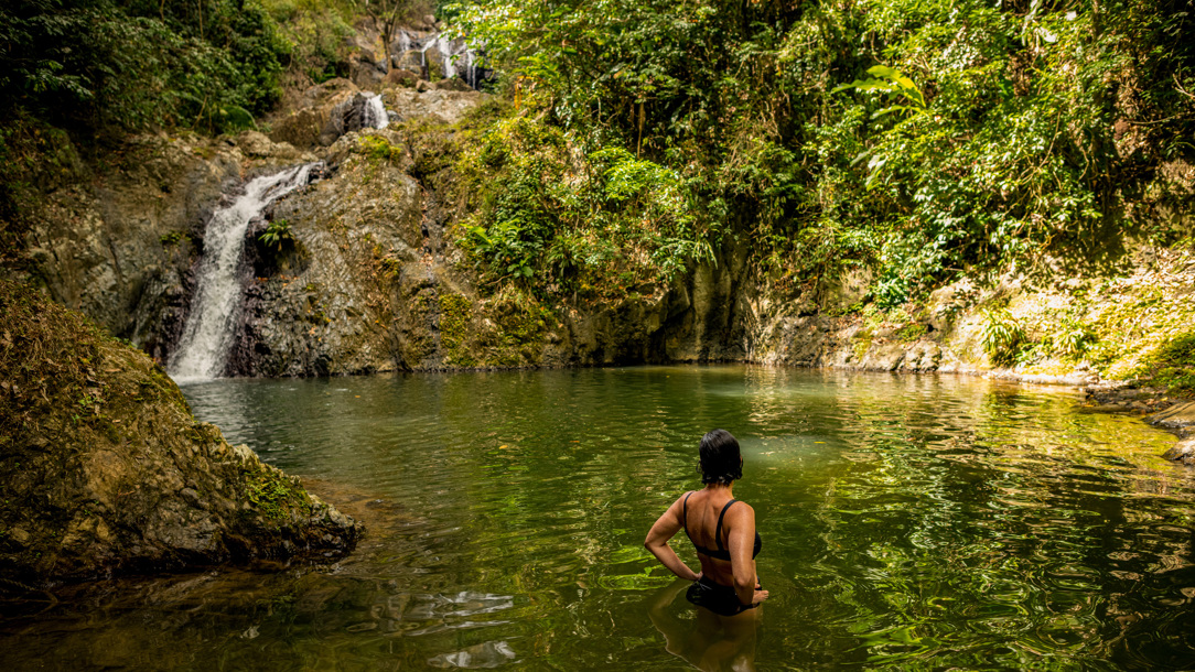A wooden boat on a beach in Tobago.