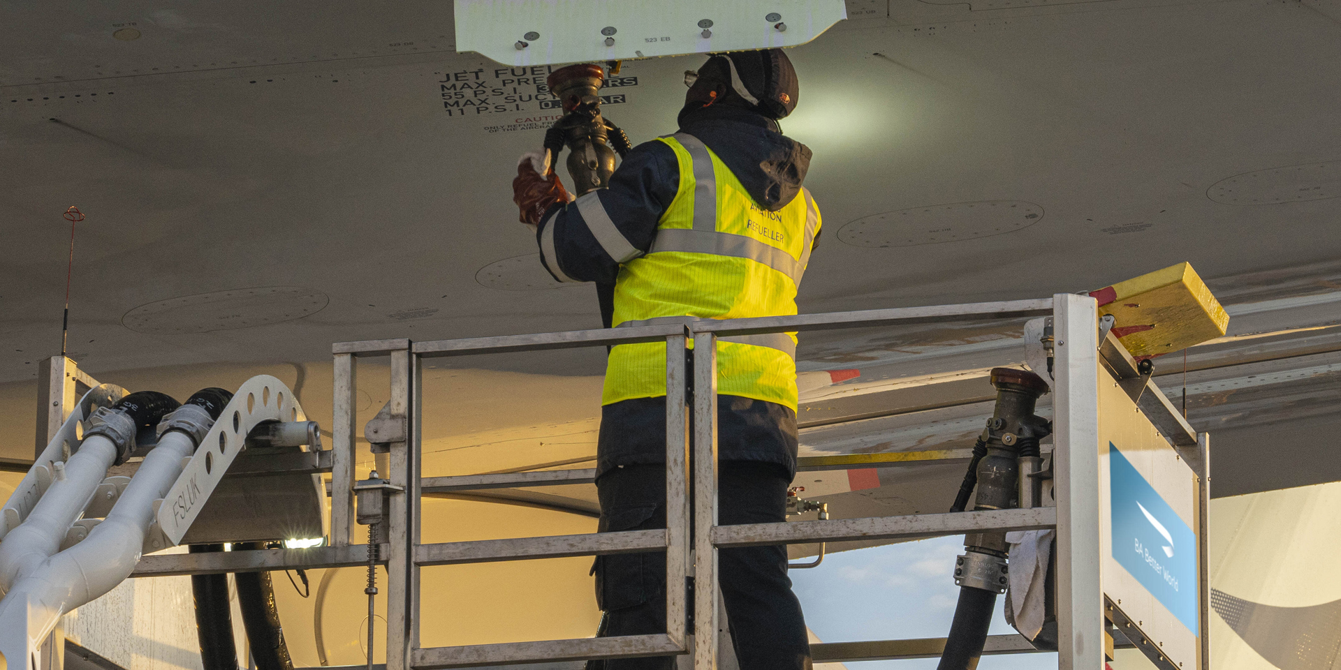 A British Airways colleague putting fuel into an airplane.