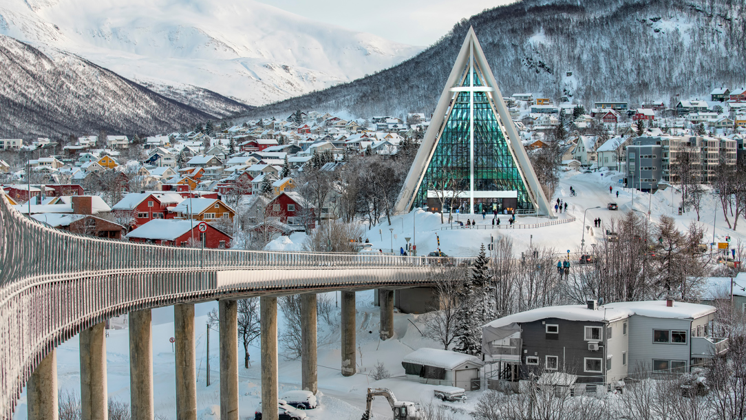 A modern cathedral in Tromso covered in snow.