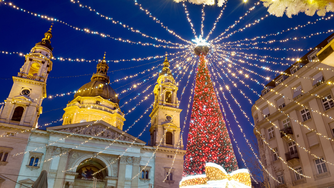 A red Christmas tree outside a church in Budapest.