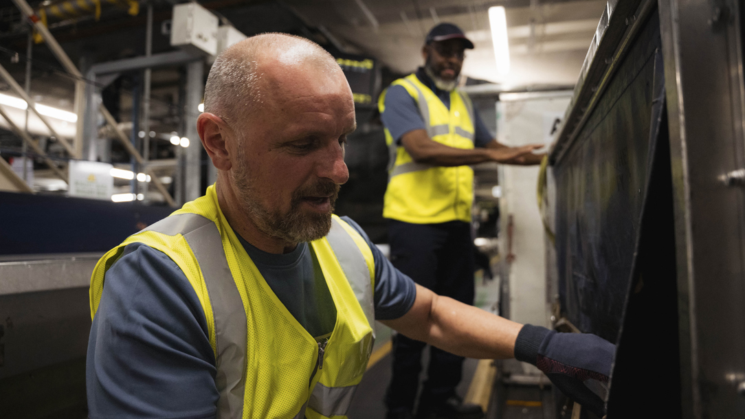 British Airways colleagues checking baggage.